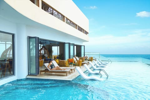 Outdoor pool, open 6 AM to 8:00 PM, sun loungers, lifeguards on site