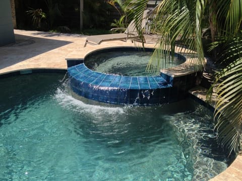 Spa with cascading water to pool, spa comfortably fits 6 (measures 6.5 ft rnd)