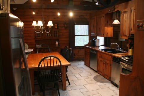 kitchen: stainless appliance, dishwasher, highchair ,coffee pot, kuerig,toaster