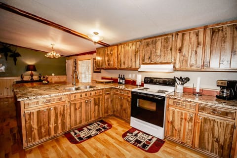 Full kitchen with stove/oven, refrigerator, coffeemaker and 2 dining areas.