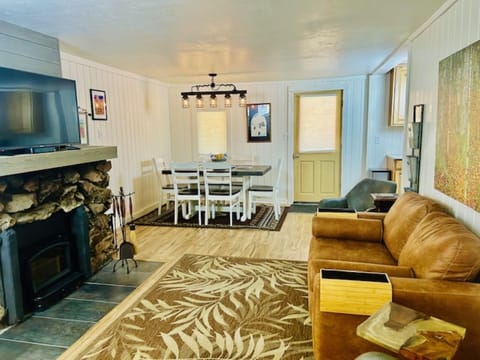 View when entering the front door. Wood-burning fireplace.