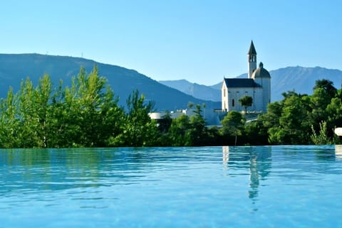 Seasonal outdoor pool, a heated pool, pool umbrellas, sun loungers