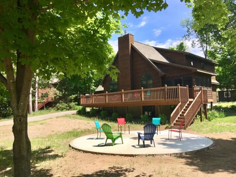 Front of house with large in-ground firepit.