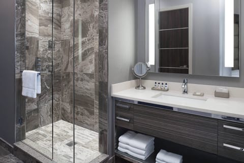 Rainfall showerhead, designer toiletries, hair dryer, towels