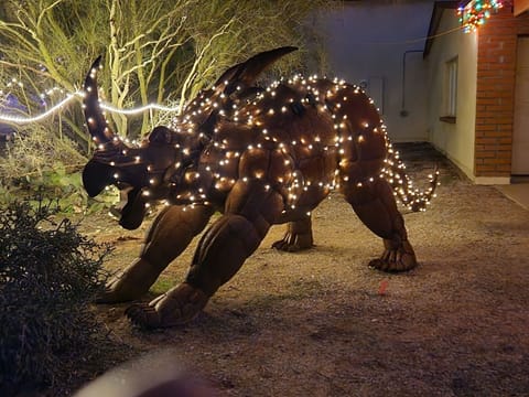 Styracosaurus at night guarding the front gate to the ranch--our2nd dinosaur.