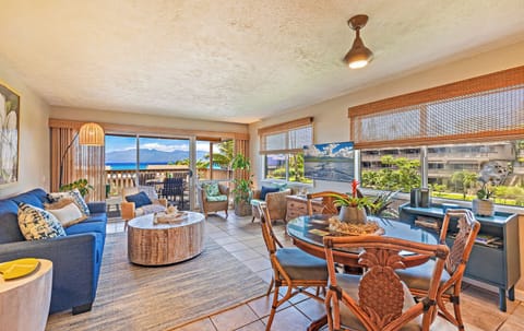 Dining and living room with sleeper sofa - Bright living area at Kahana Sunset E11 with sleeper sofa and ocean breezes
