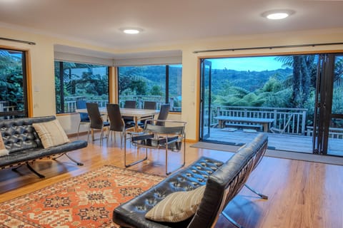 Open plan living with bush and lake view.