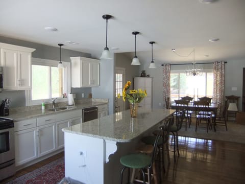 Open concept kitchen with granite counter top