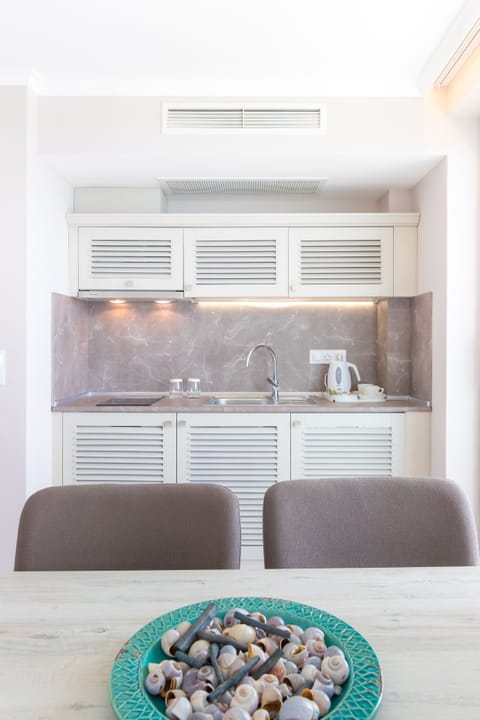 Suite, Sea View | Private kitchen | Coffee/tea maker, electric kettle, highchair