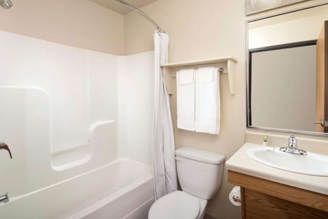 Desk, laptop workspace, blackout drapes, iron/ironing board