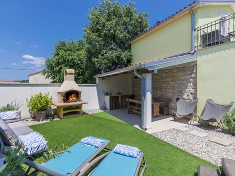 Plant, Sky, Property, Building, Shade, Architecture, Grass, Outdoor Furniture, Leisure, House