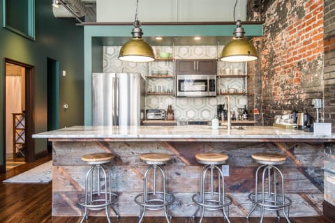 Kitchen and dining area are open to the TV sitting area