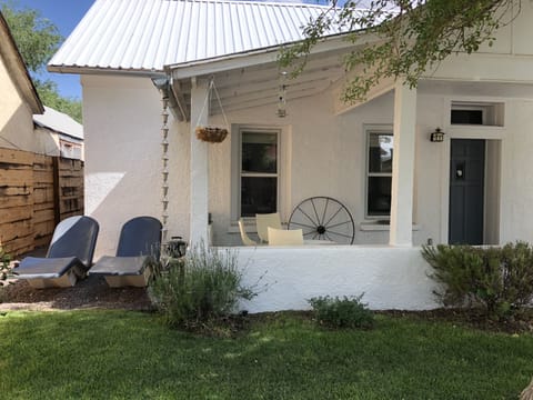 Front porch with plenty of space to sit and hang out watching Downtown.