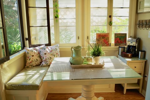 Delicious complimentary coffee, creamer and tea provided in kitchen nook.