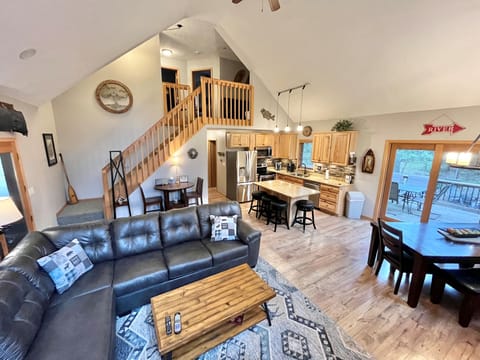 View up stairwell into loft & 2 bedrooms.  High top table/chairs, BOSE Bluetooth