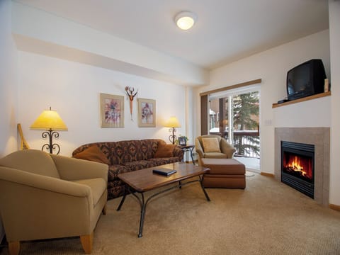 Cozy up by your crackling fireplace while soft lamplight creates the perfect ambiance for relaxing evenings in your mountain retreat.