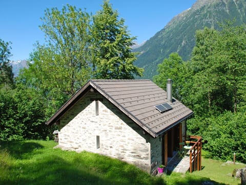House, Cottage, Property, Natural Landscape, Hut, Roof, Mountain, Building, Tree, Rural Area