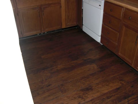 Laminated wood floor in kitchen and hallway