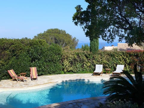 Water, Plant, Sky, Property, Swimming Pool, Azure, Natural Landscape, Tree, Grass, Outdoor Furniture