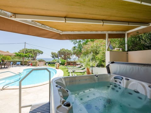 Water, Property, Swimming Pool, Azure, Shade, Plant, Building, Outdoor Furniture, Leisure, Composite Material