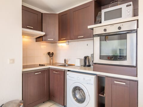 Cabinetry, Countertop, Property, Furniture, Laundry Room, Sink, Home Appliance, Kitchen Sink, Kitchen Stove, Kitchen Appliance