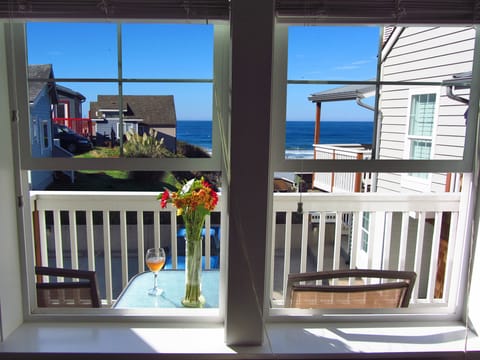 Relax on the balcony while watching the waves crash on the beach...