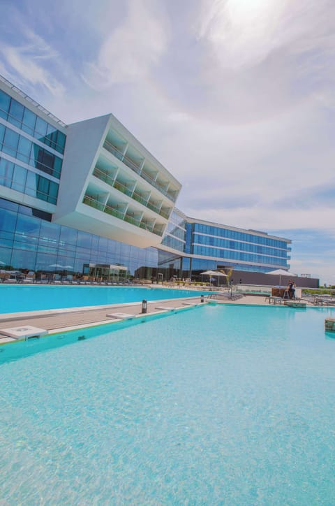 Indoor pool, seasonal outdoor pool, open 10 AM to 8 PM, pool umbrellas