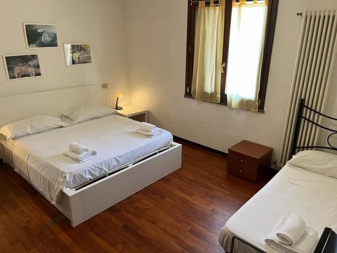 Triple Room, Courtyard View (Room 03) | Desk, WiFi (free), bed sheets