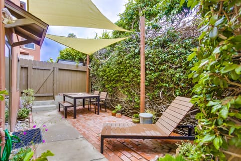 Partial view of the large fenced patio. Outdoor dining under the shade sails!