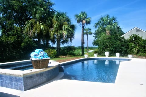 Large swimming pool  and spillover spa with golf course views and spillover spa