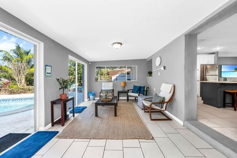 The Florida Room offers more seating & pool views. Perfect relaxation spot.