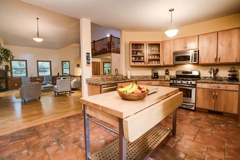 The open kitchen w/ view to the Great Room