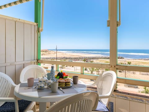 Sky, Water, Furniture, Table, Property, Chair, Building, Azure, Seaside Resort, Shade