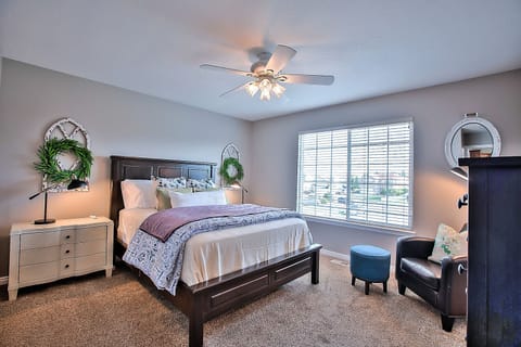 Master bedroom with queen bed, walk in closet, smart TV