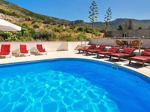 Water, Property, Sky, Furniture, Swimming Pool, Azure, Outdoor Furniture, Plant, Tree, Body Of Water