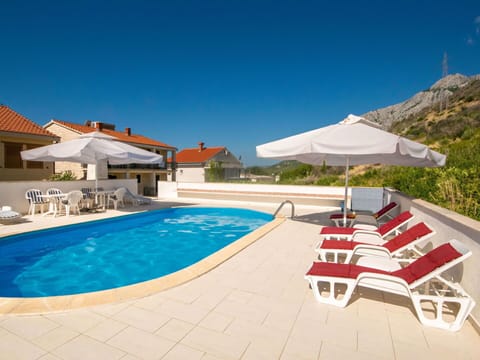 Water, Sky, Plant, Swimming Pool, Sunlounger, Shade, Outdoor Furniture, Building, Umbrella, Chair