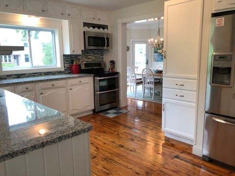 Updated and fully stocked kitchen with new fridge