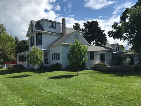 Backyard complete with patio, grill, fire pit and chairs
