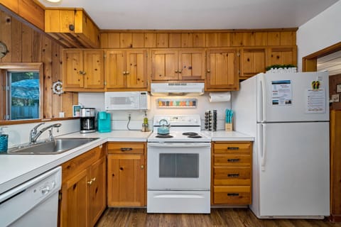 Beachy Pine kitchen has room to cook big and small meals if you want to eat in!