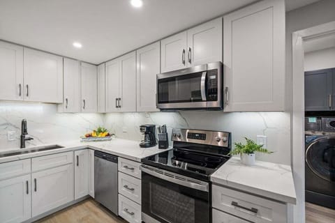 Enjoy cooking at your fully furnished kitchen with stainless steel appliances