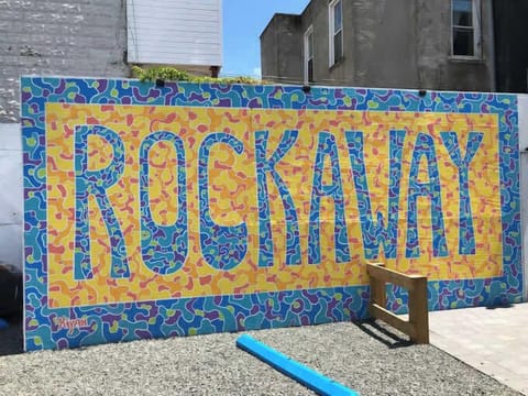 Iconic Rockaway mural adds local charm and beach-town character—perfect backdrop showcasing the neighborhood’s vibrant, creative spirit.
