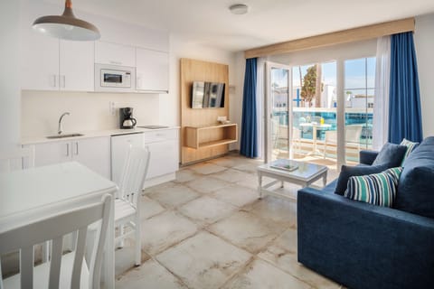 Premium Suite, 1 Bedroom | Living area | 32-inch LCD TV with satellite channels, TV