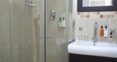 Studio (Self Catering) | Bathroom | Shower, rainfall showerhead, hair dryer, towels