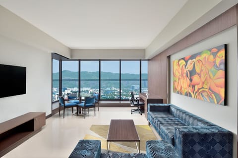 Premier Suite, 1 Bedroom, Pool View | Living room | 43-inch LED TV with cable channels, TV