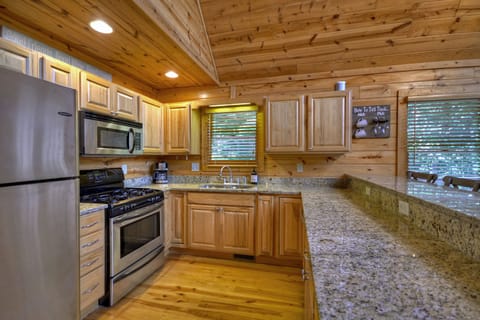 Kitchen with stainless appliances and gas stove