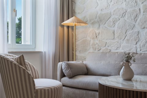 Junior Suite Balcony | Living area | 78-cm LCD TV with satellite channels, TV