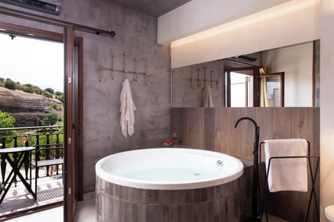 The Hot Tub Suite with Fireplace & Steam Shower | Private spa tub