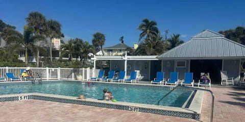 The pool is about half way between the dock and the beach.