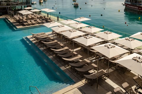 Indoor pool, outdoor pool, pool umbrellas, sun loungers