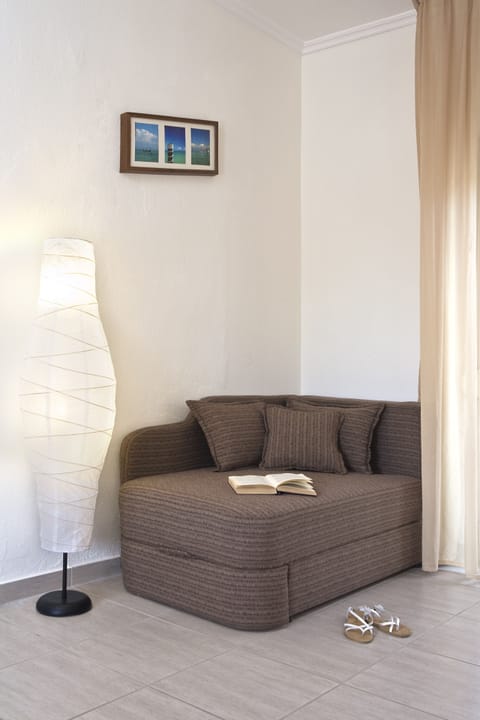 Suite, 1 Queen Bed with Sofa bed | Living area | 32-inch flat-screen TV with satellite channels, TV